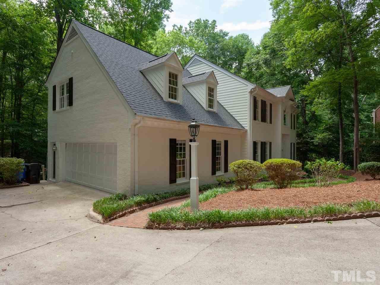 701 Presnell Court Raleigh, NC 27615 - Photo 24 of 24 a front view of a house with a garden and yard