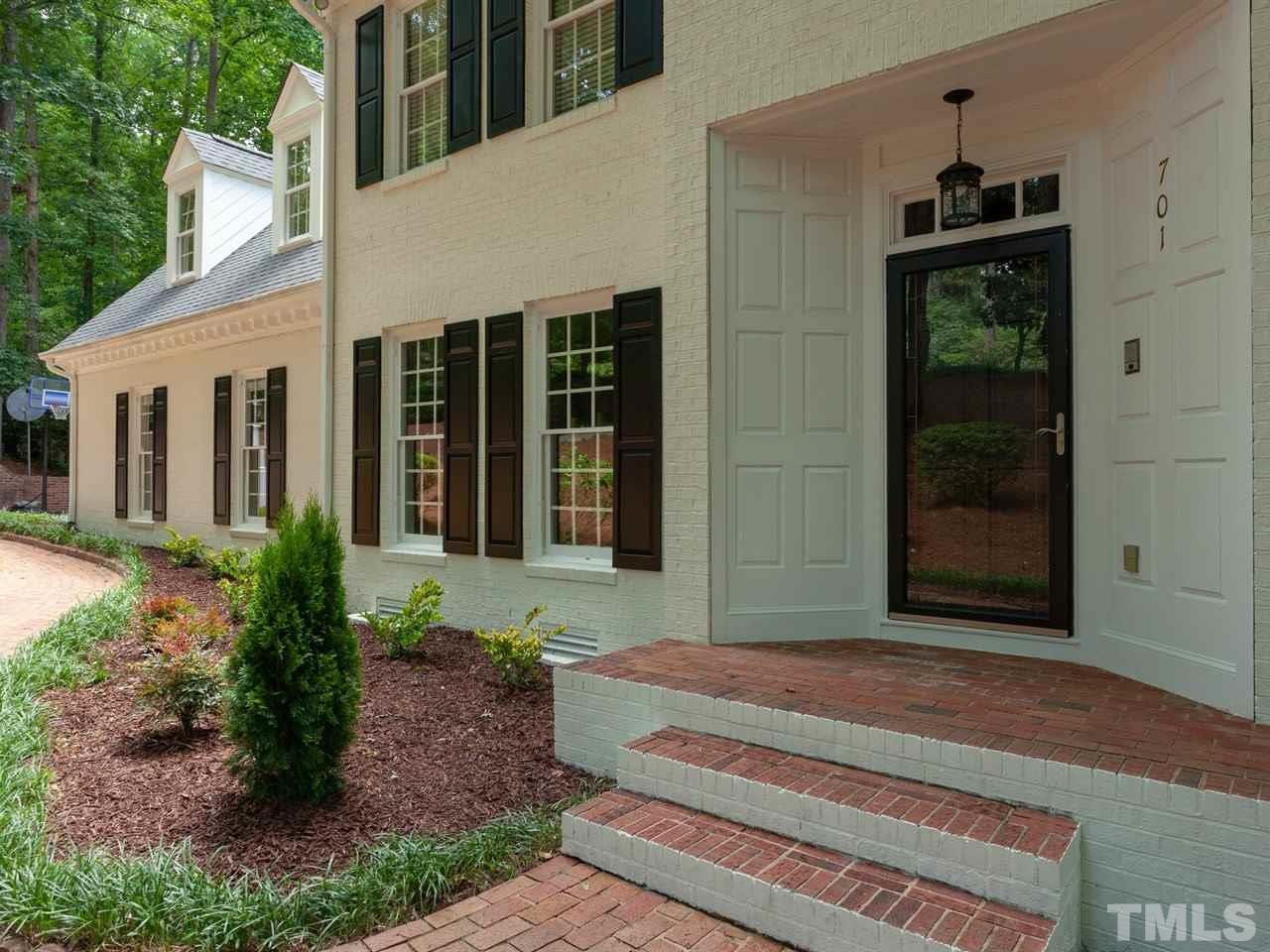 701 Presnell Court Raleigh, NC 27615 - Photo 4 of 24 a front view of a house with a yard