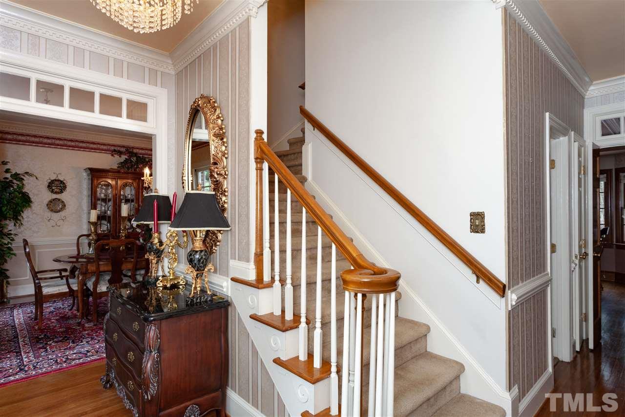 701 Presnell Court Raleigh, NC 27615 - Photo 5 of 24 a view of an entryway with wooden floor and windows