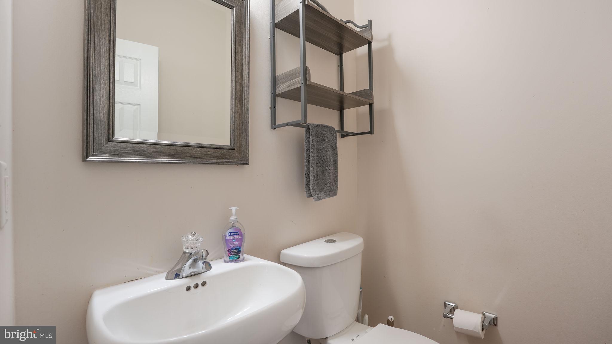 408 Longleaf Drive Perkasie, PA 18944 - Photo 15 of 36 a bathroom with a sink and mirror
