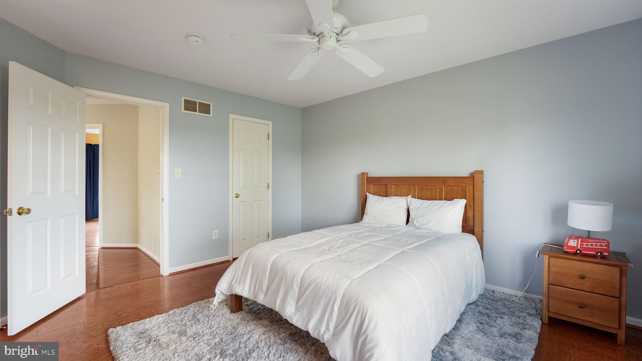 408 Longleaf Drive Perkasie, PA 18944 - Photo 22 of 36 a bedroom with a bed and wooden floor