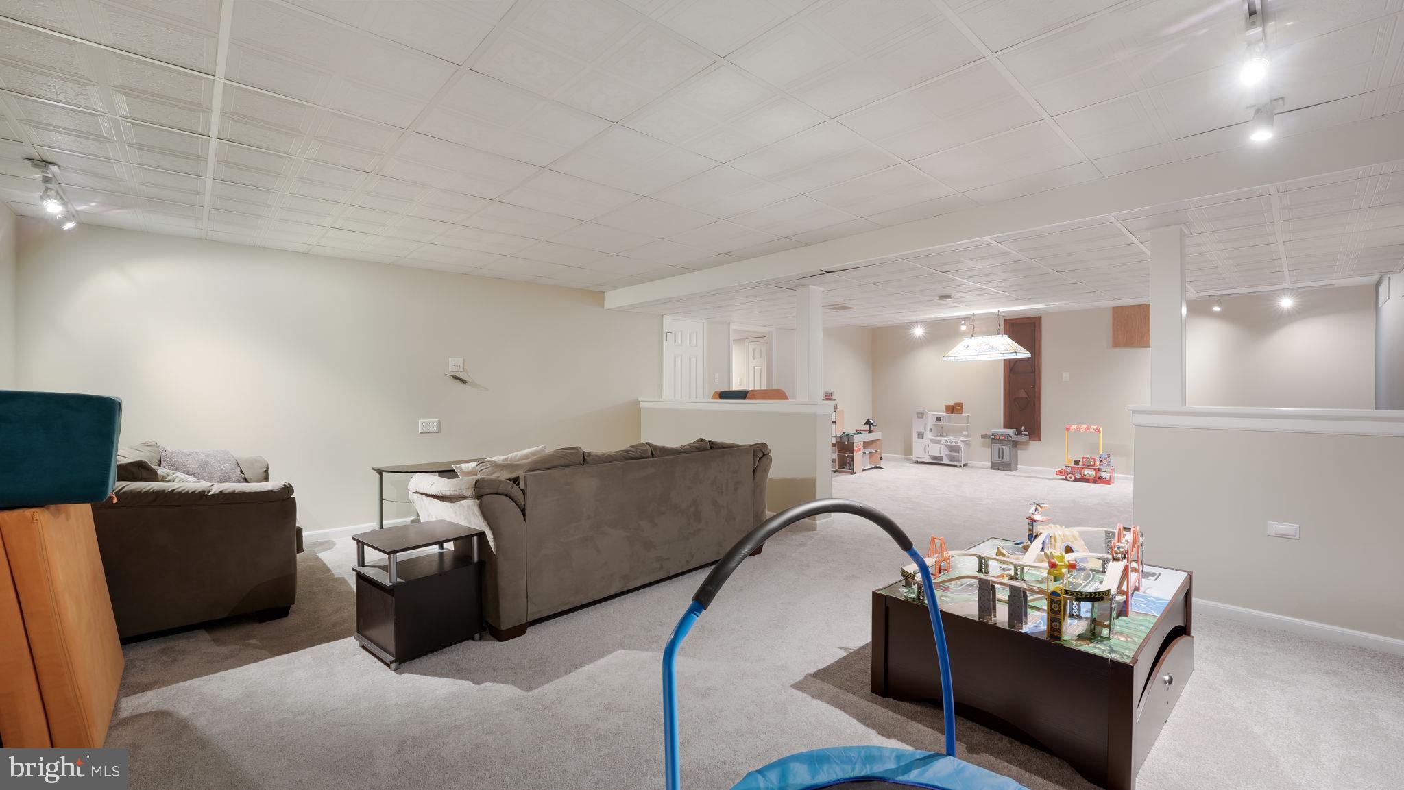 408 Longleaf Drive Perkasie, PA 18944 - Photo 28 of 36 a living room with furniture and a window