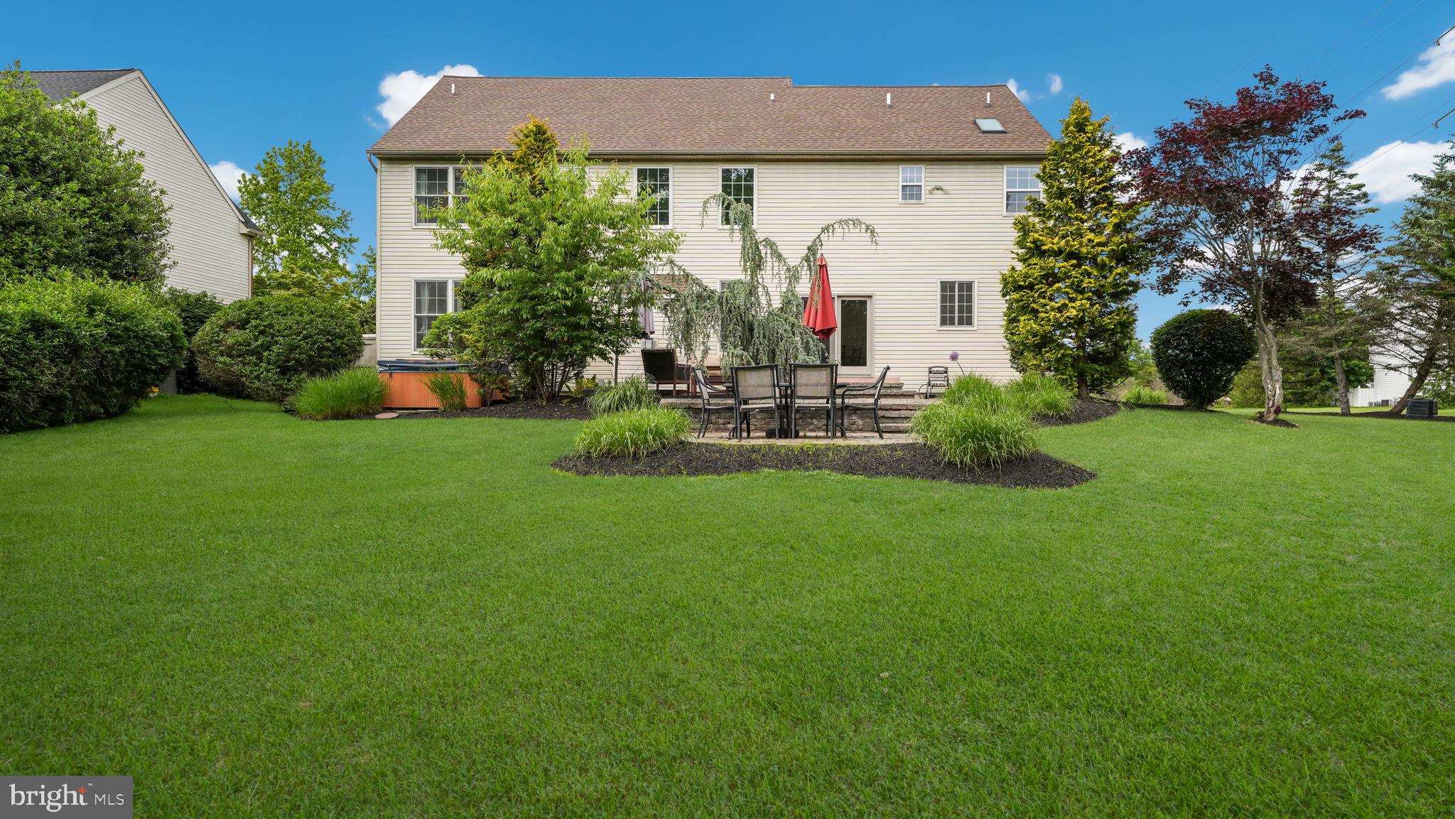 408 Longleaf Drive Perkasie, PA 18944 - Photo 29 of 36 a view of a house with a backyard and a patio