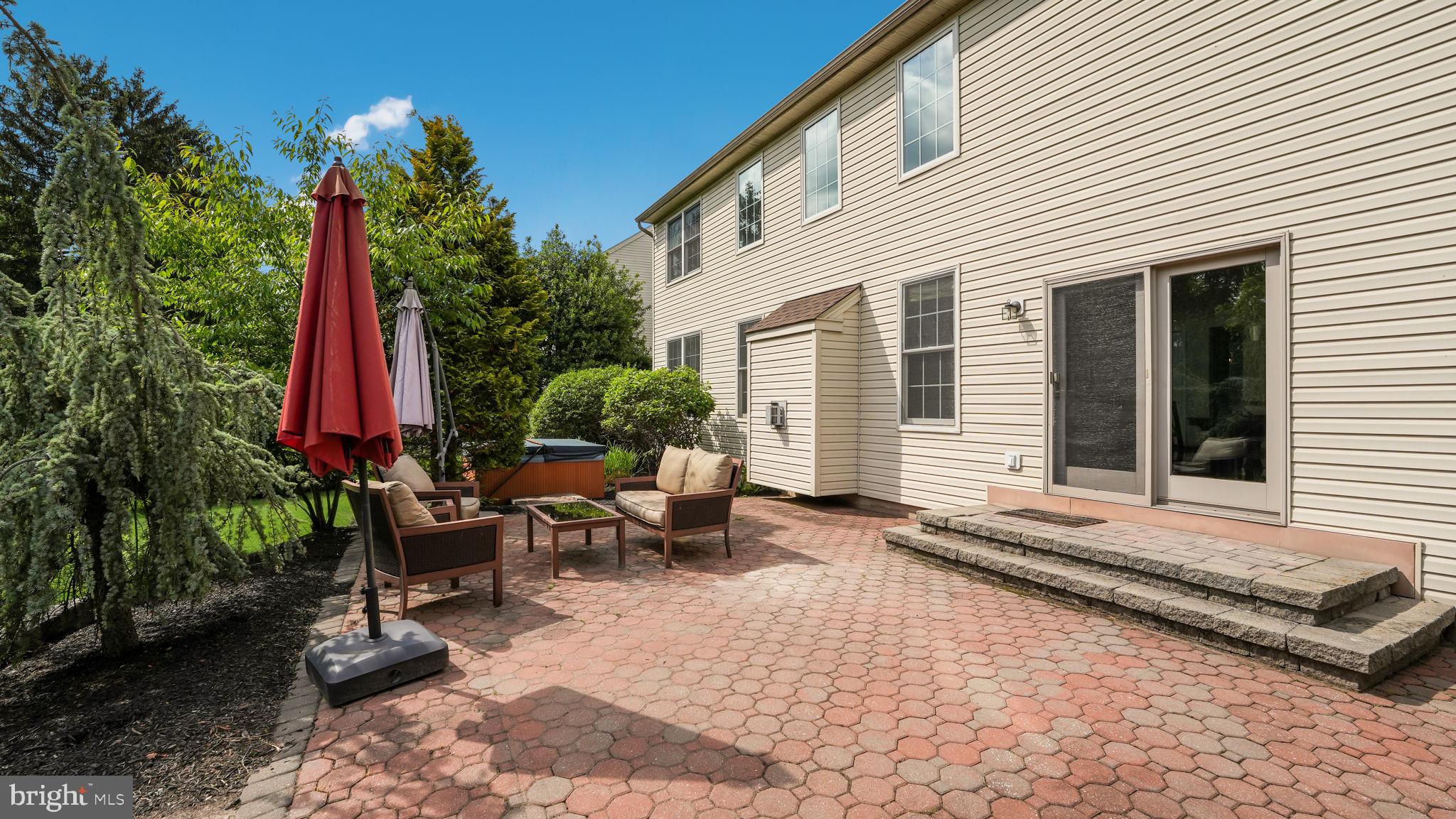 408 Longleaf Drive Perkasie, PA 18944 - Photo 30 of 36 a backyard of a house with yard fire pit and outdoor seating