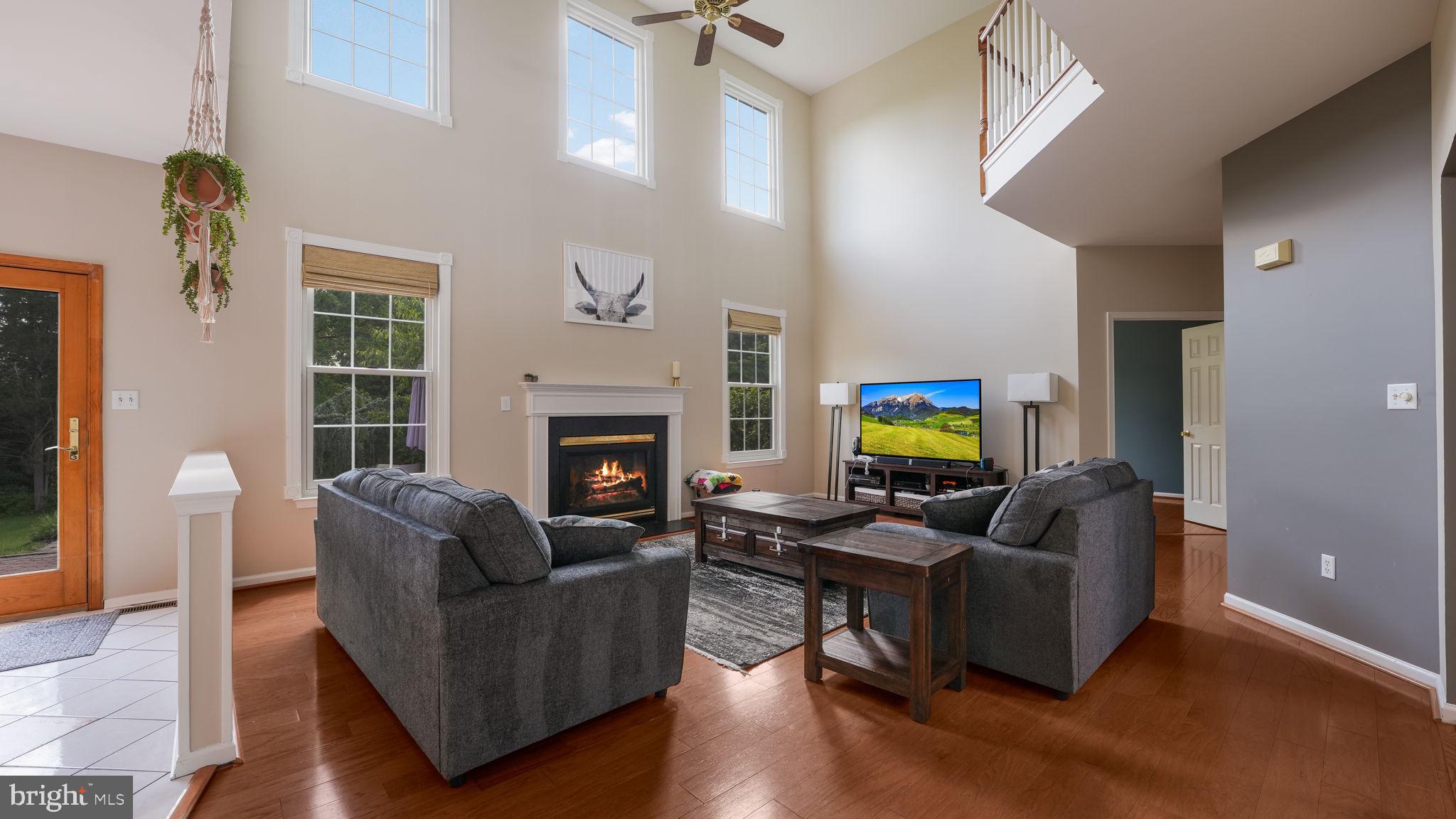408 Longleaf Drive Perkasie, PA 18944 - Photo 7 of 36 a living room with furniture fireplace and a flat screen tv