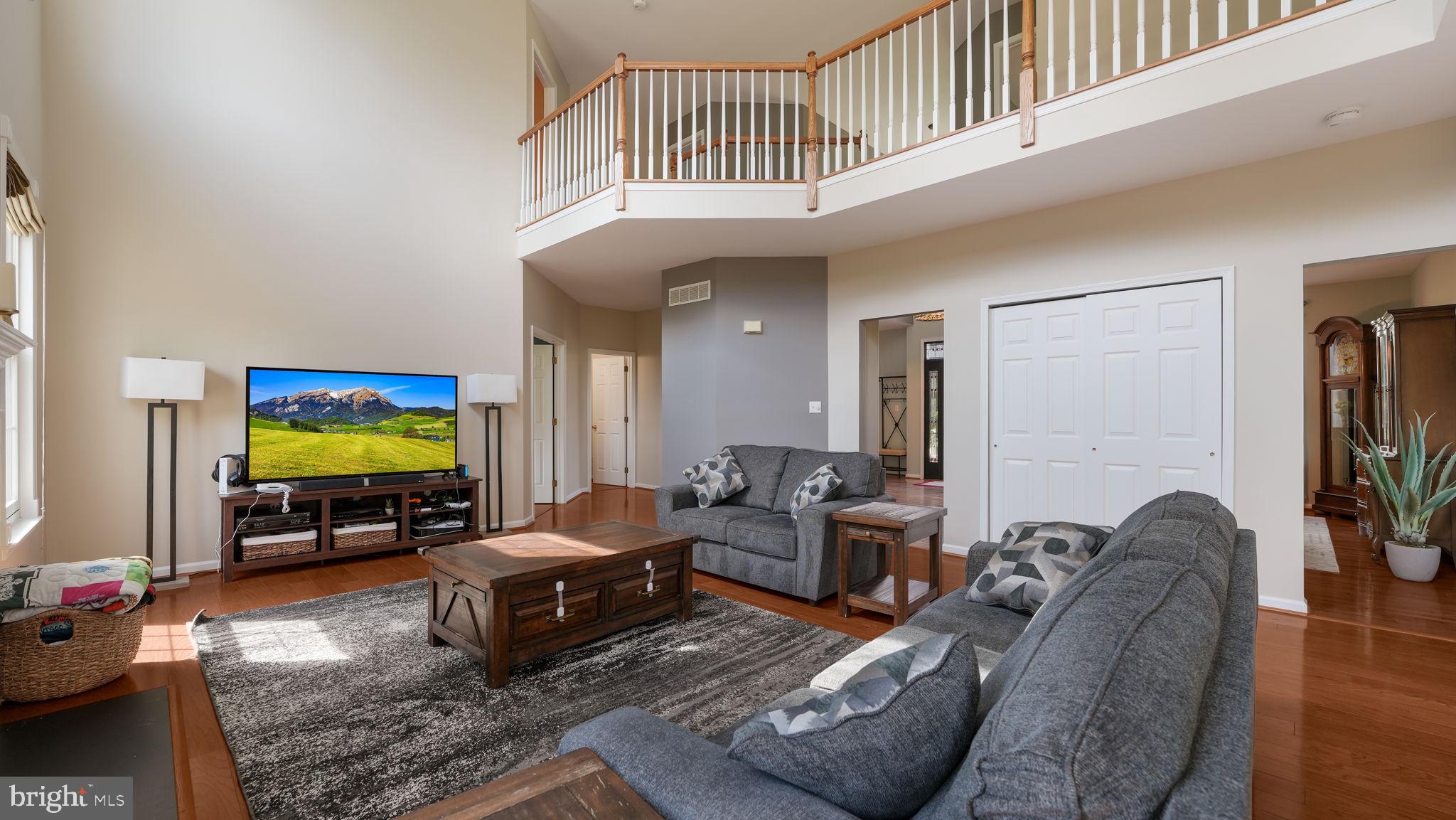 408 Longleaf Drive Perkasie, PA 18944 - Photo 9 of 36 a living room with furniture and a flat screen tv