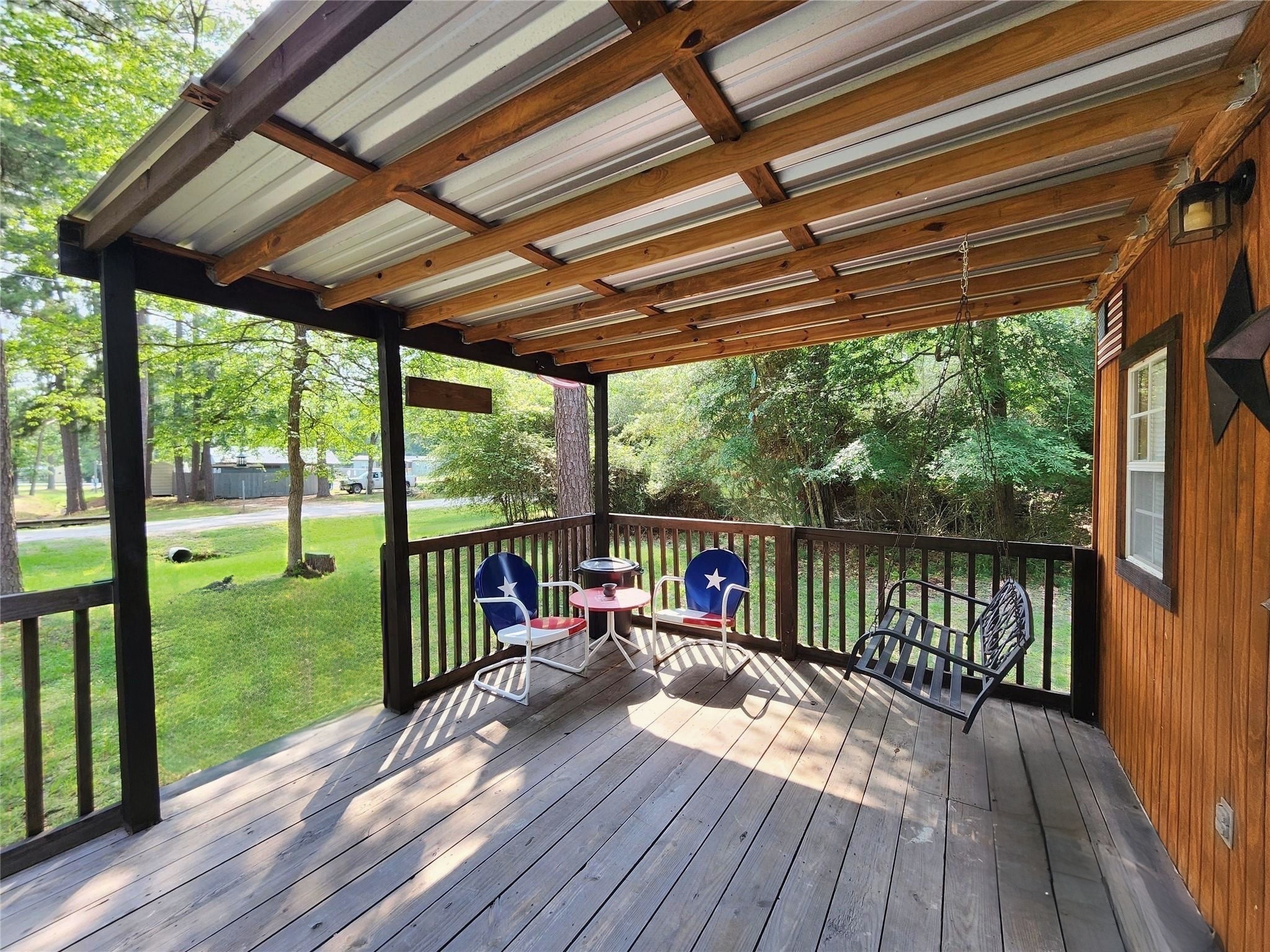 a view of balcony with wooden floor