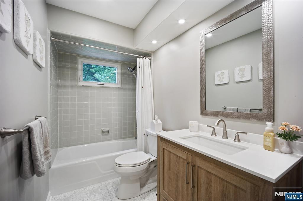23 Andover Place Bloomfield, NJ 07003 - Photo 17 of 42 a bathroom with a sink a toilet and shower