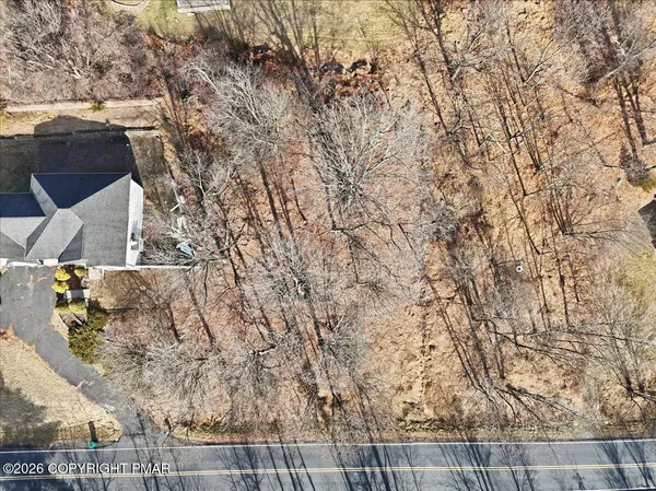 a view of house with a yard