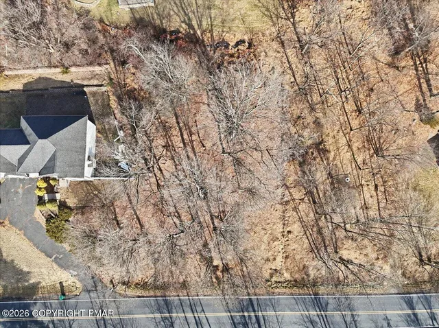 a view of house with a yard