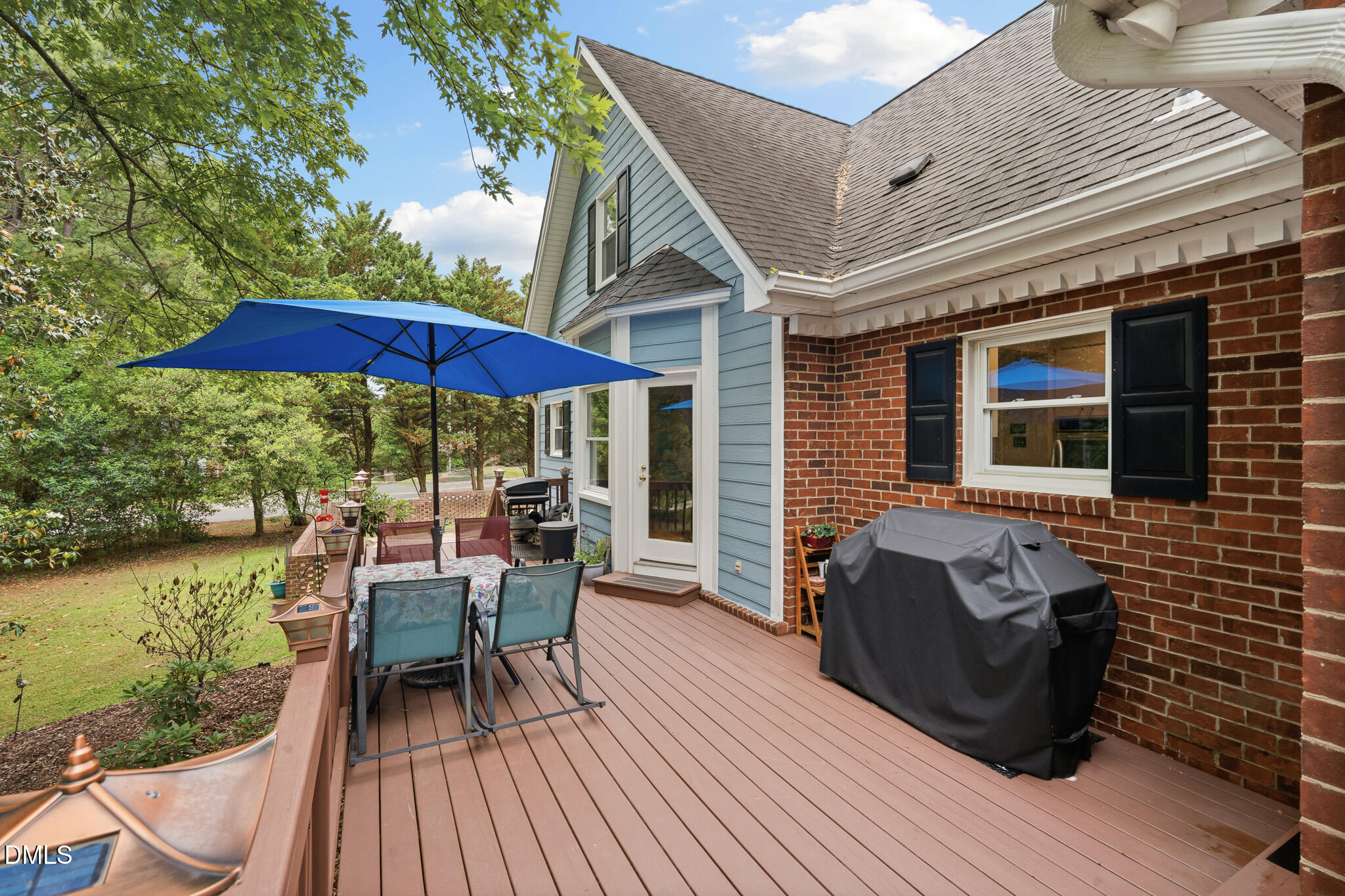 3735 Stoneybrook Drive Durham, NC 27705 - Photo 37 of 44 a balcony with furniture and umbrella