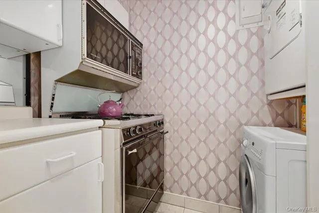 a kitchen with a stove and a sink