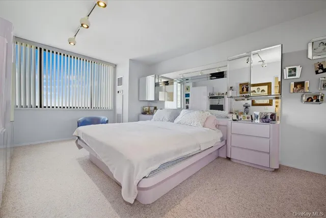 a large white bed in a white room