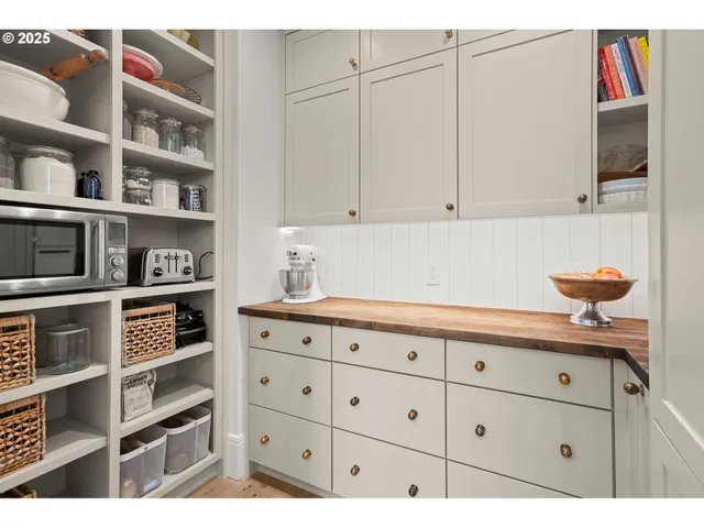 a kitchen with cabinets and appliances
