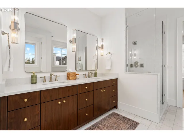 a bathroom with a sink vanity granite shower and a mirror