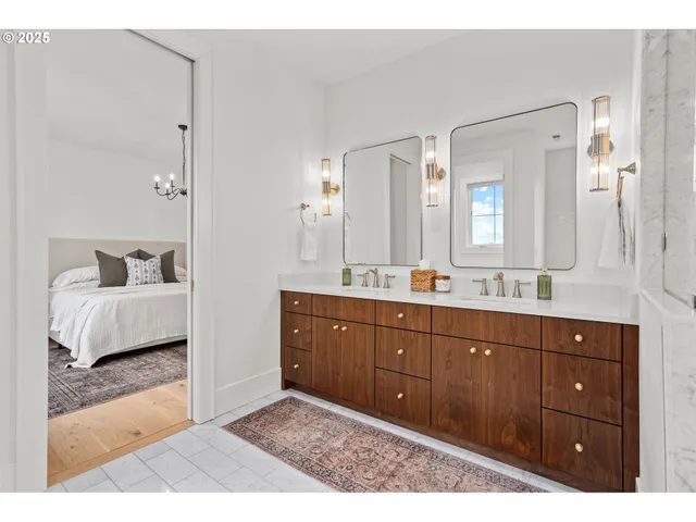 a spacious bathroom with a sink and a mirror