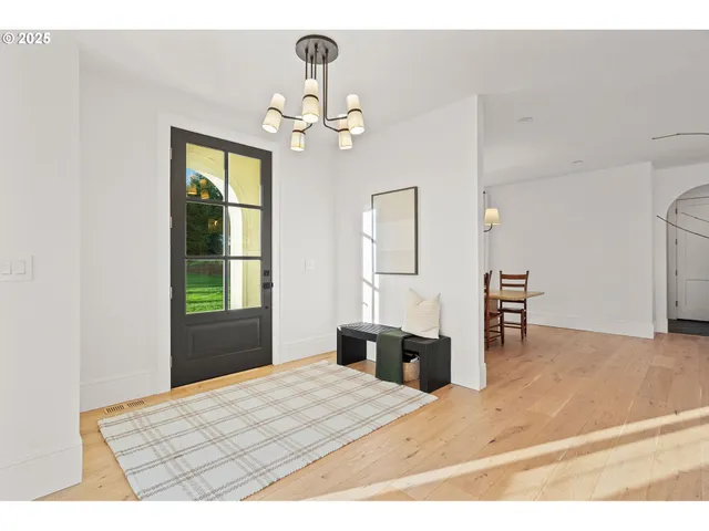 a bedroom with a bed dresser and a window