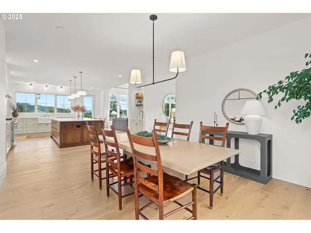 a dining room with furniture and wooden floor