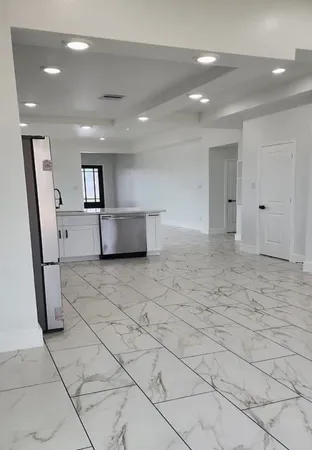 a bathroom with a sink double vanity and a mirror