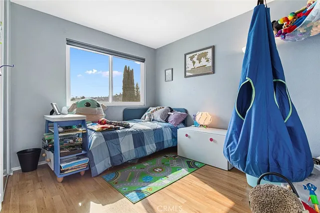 a view of an empty room and wooden floor