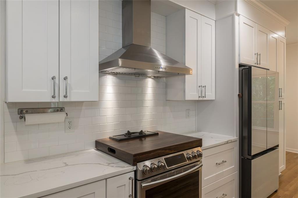 1018 Berne Street Southeast Atlanta, GA 30316 - Photo 14 of 34 a stove top oven sitting inside of a kitchen