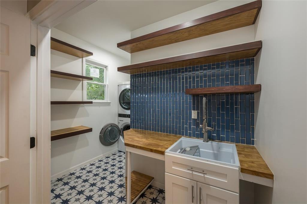 1018 Berne Street Southeast Atlanta, GA 30316 - Photo 21 of 34 a room with a washing machine and racks