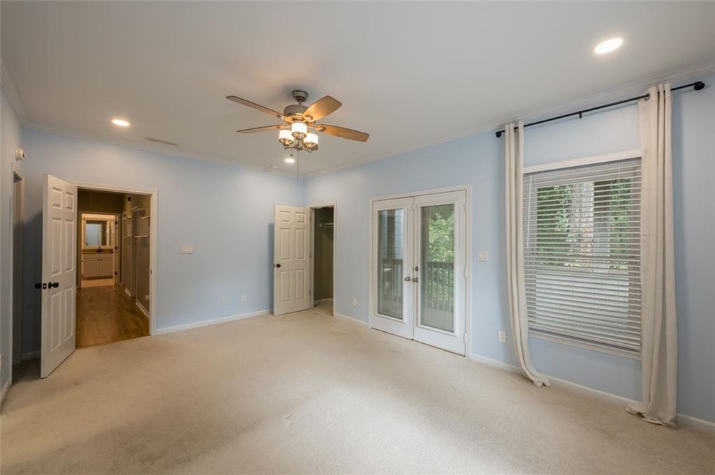 1018 Berne Street Southeast Atlanta, GA 30316 - Photo 25 of 34 a view of a livingroom with a chandelier fan and windows