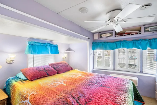 a living room with furniture a rug and a window