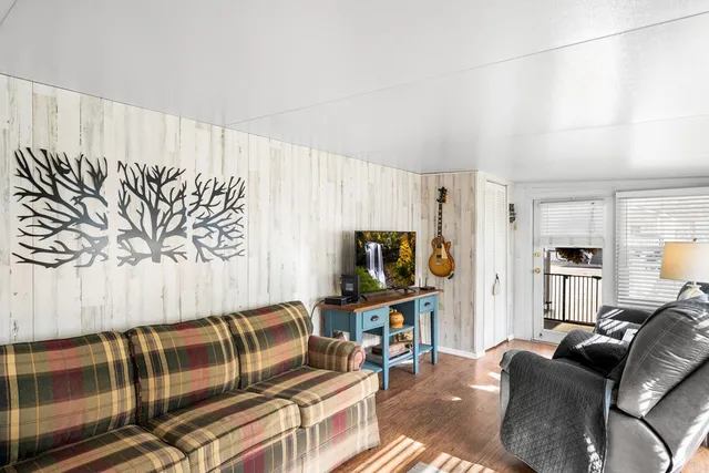a view of a livingroom with furniture and window