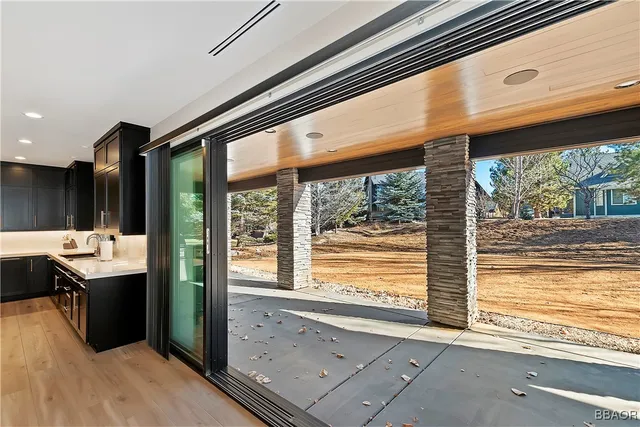 a bathroom with a sink and a large window
