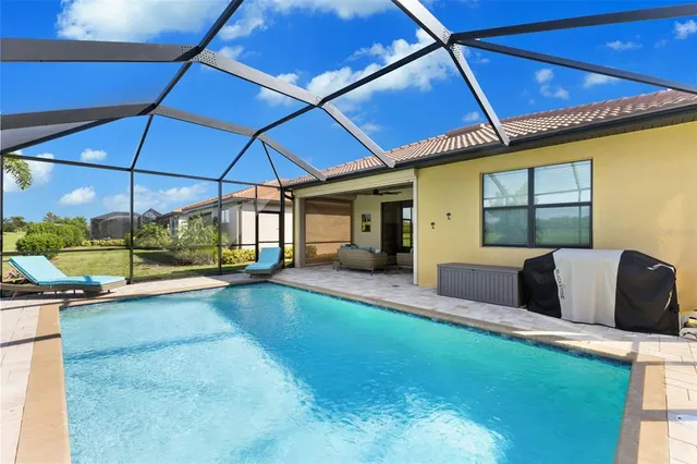 a living room with stainless steel appliances kitchen island granite countertop furniture and a view of kitchen