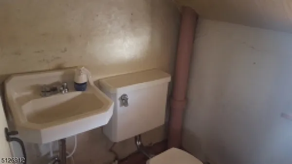 a bathroom with a sink and a toilet