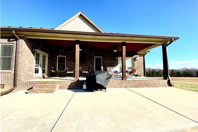a view of swimming pool with outdoor seating