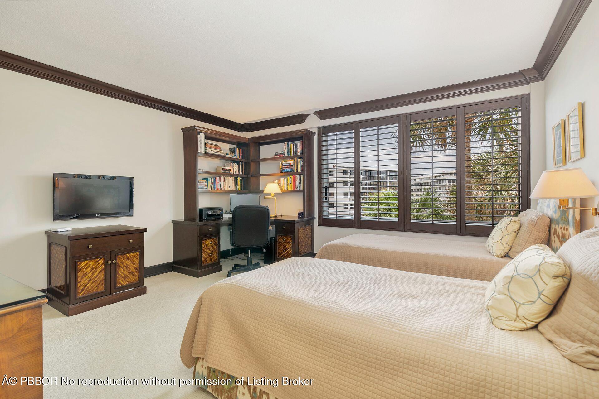 170 North Ocean Boulevard, Unit 409 Palm Beach, FL 33480 - Photo 14 of 34 a bed room with a bed and a television