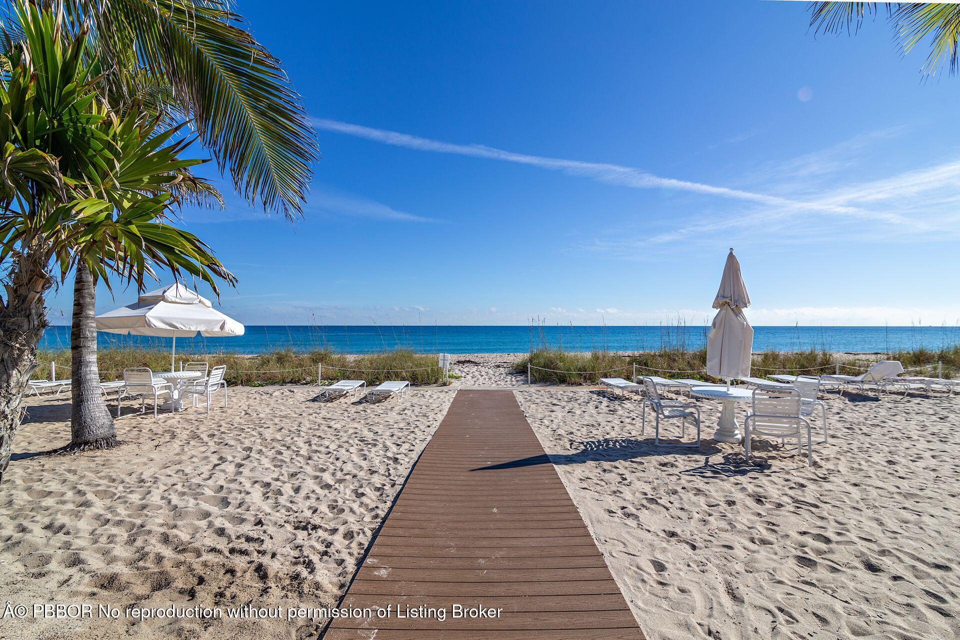 170 North Ocean Boulevard, Unit 409 Palm Beach, FL 33480 - Photo 22 of 34 a view of a roof with wooden floor and a yard
