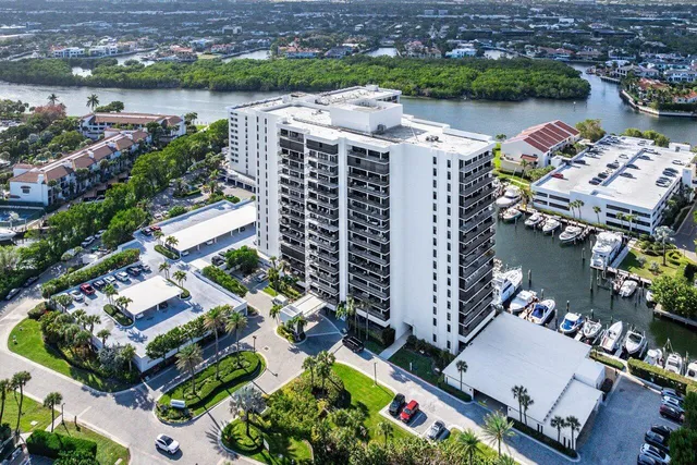an aerial view of lake and residential houses with outdoor space