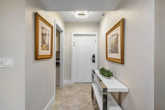 a hallway with table and chair