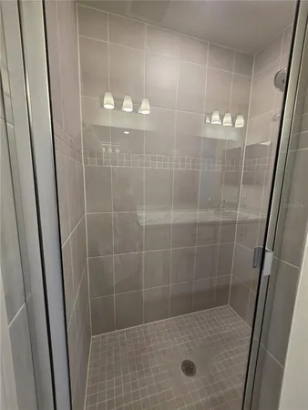 a white toilet sitting next to a sink