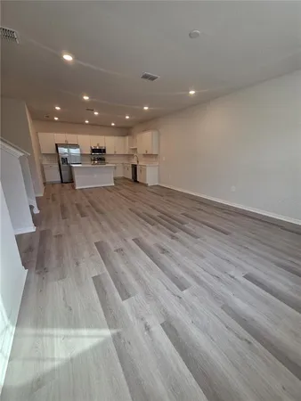 a view of kitchen with cabinets