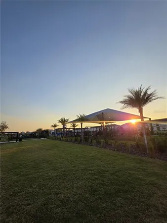 a childrens park with lots of swings and slides