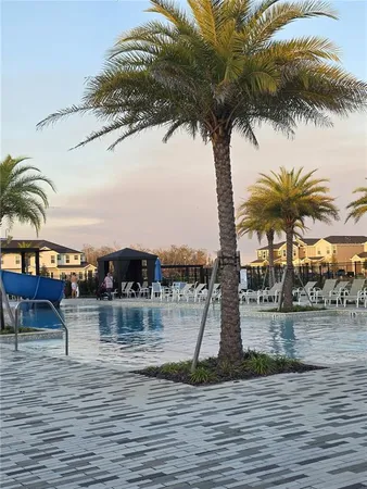a view of a ocean with a building in the background