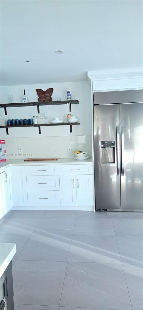 4012 East Shore Road Miramar, FL 33023 - Photo 11 of 22 a kitchen with a refrigerator and cabinets