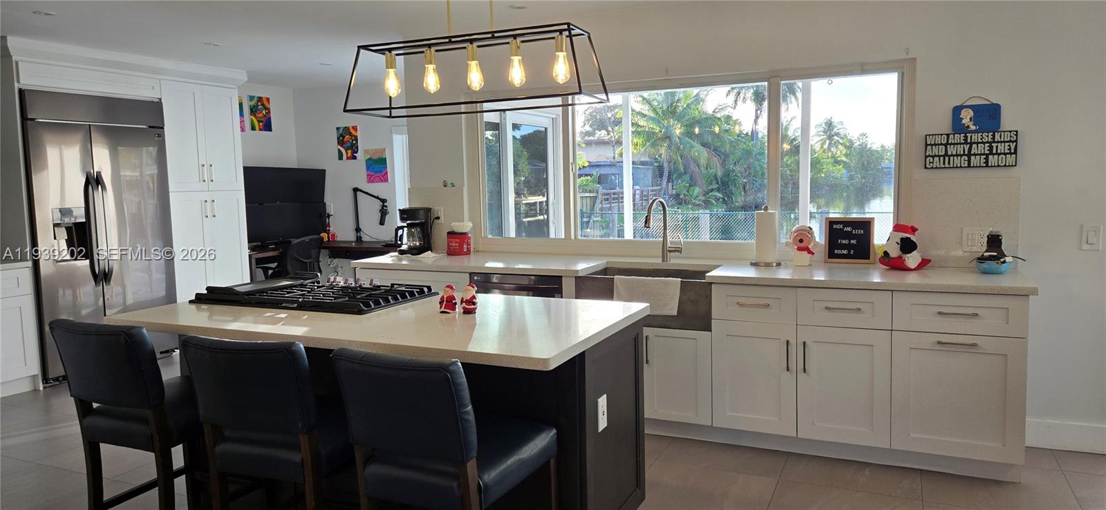 4012 East Shore Road Miramar, FL 33023 - Photo 16 of 22 a kitchen with a sink stove and refrigerator