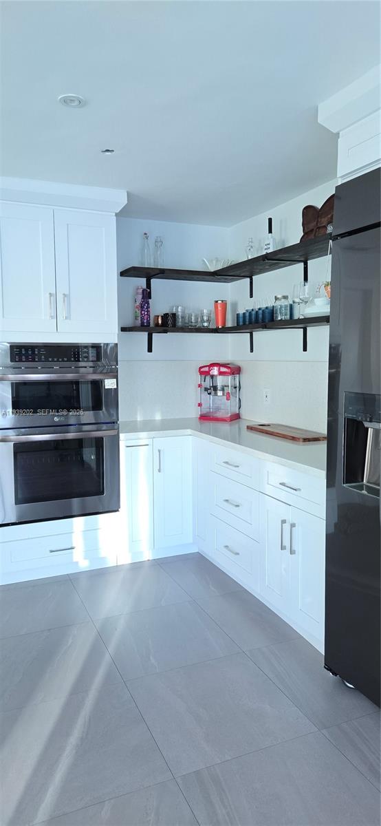 4012 East Shore Road Miramar, FL 33023 - Photo 18 of 22 a kitchen with cabinets appliances and a counter space