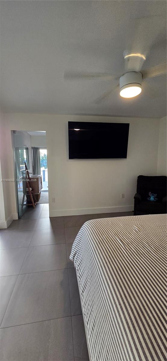 4012 East Shore Road Miramar, FL 33023 - Photo 20 of 22 a bedroom with a bed and a view of balcony