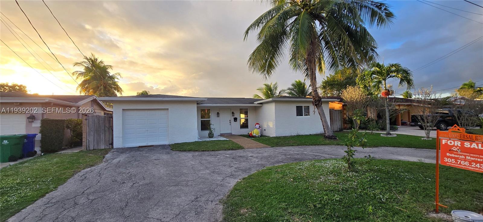 4012 East Shore Road Miramar, FL 33023 - Photo 2 of 22 a view of a yard in front view of a house