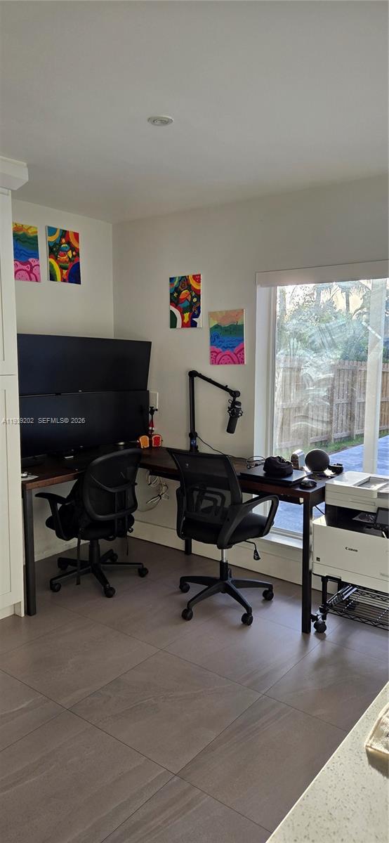 4012 East Shore Road Miramar, FL 33023 - Photo 5 of 22 a view of a workspace with furniture and a window