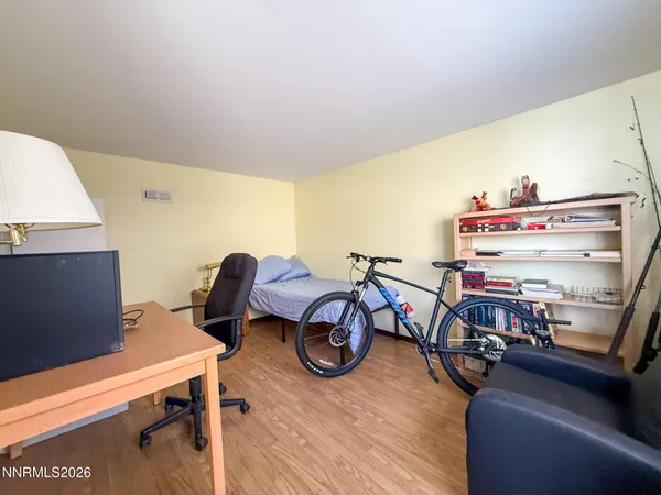 a room with furniture and a wooden floor