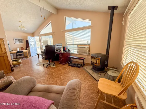 a living room with furniture window and a flat screen tv