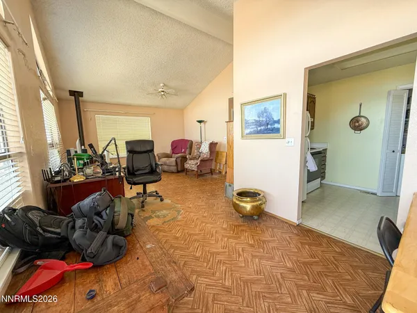 a living room with furniture and a mirror
